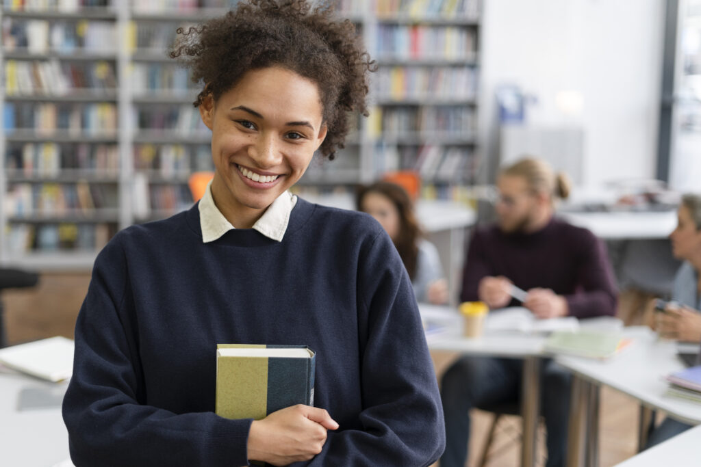 medium-shot-smiley-woman-holding-book